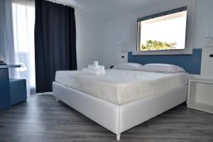 Ένα ή περισσότερα κρεβάτια σε δωμάτιο στο Hotel Calypso