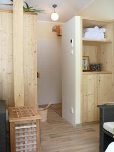 a room with wood paneling and a room with a door at Hotel Forsthaus in Bad Schandau