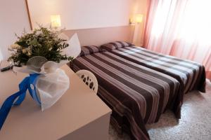 Posteľ alebo postele v izbe v ubytovaní Hotel il Delfino