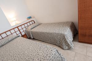 Posteľ alebo postele v izbe v ubytovaní Hotel il Delfino