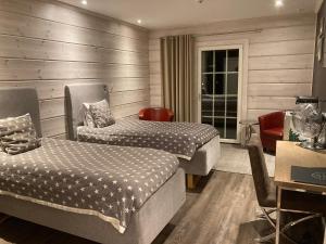 Postel nebo postele na pokoji v ubytování Lapland Lodge