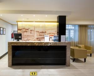TV a/nebo společenská místnost v ubytování Veneza Hotel