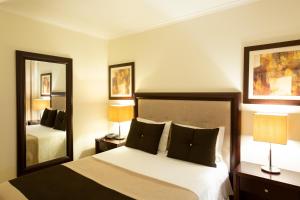 Postel nebo postele na pokoji v ubytování Veneza Hotel