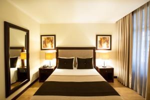 Postel nebo postele na pokoji v ubytování Veneza Hotel