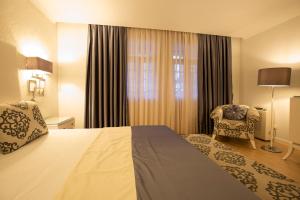 Postel nebo postele na pokoji v ubytování Veneza Hotel