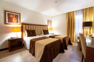 Postel nebo postele na pokoji v ubytování Veneza Hotel