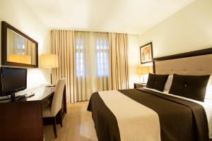 Postel nebo postele na pokoji v ubytování Veneza Hotel