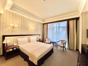 Postel nebo postele na pokoji v ubytování Sofievsky Posad Hotel