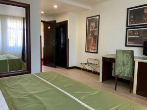 Postel nebo postele na pokoji v ubytování Veneza Hotel