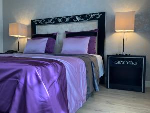 Postel nebo postele na pokoji v ubytování Veneza Hotel