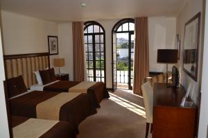 Postel nebo postele na pokoji v ubytování Veneza Hotel