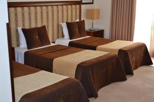 Postel nebo postele na pokoji v ubytování Veneza Hotel