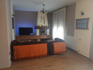 TV a/nebo společenská místnost v ubytování La Cerca