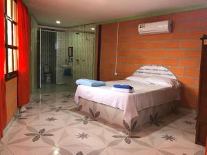 Säng eller sängar i ett rum på Hostal Brisas del Campo