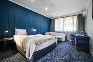 Ένα ή περισσότερα κρεβάτια σε δωμάτιο στο Country Comfort Armidale