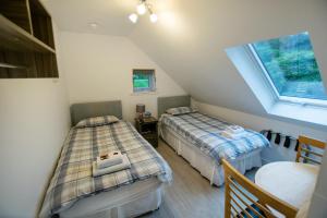 A bed or beds in a room at Corran Bunkhouse 