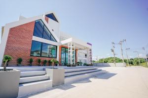 a building with stairs in front of it at Khun Ying Hotel in Nan