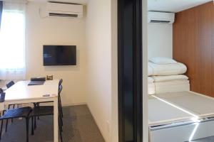 TV a/nebo společenská místnost v ubytování HOTEL R9 The Yard Isumi, Chiba