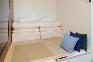 Postel nebo postele na pokoji v ubytování HOTEL R9 The Yard Isumi, Chiba