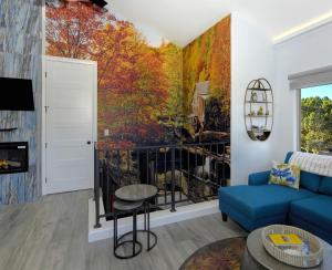 a living room with a painting on the wall at Cathedral Casita where indulgence meets peace and tranquility! in Sedona