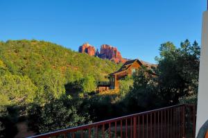 a house in the middle of a mountain with red rocks at Cathedral Casita where indulgence meets peace and tranquility! in Sedona