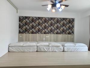 سرير أو أسرّة في غرفة في Cian Yuan B&B