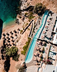 an aerial view of a beach with a swimming pool at The Wild by Interni in Kalafatis