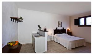 Postel nebo postele na pokoji v ubytování AGRITURISMO CASA VACANZE Antico Baglio