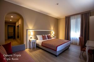 
Кровать или кровати в номере Hotel Villa Malpensa
