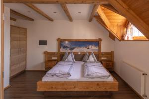 A bed or beds in a room at Residence Rogger
