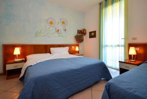 Кровать или кровати в номере Villaggio Marco Polo