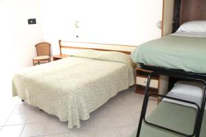 Postel nebo postele na pokoji v ubytování Hotel I 4 Assi