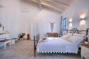 Posteľ alebo postele v izbe v ubytovaní Villa Marmari
