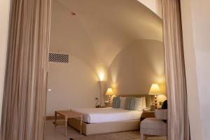 Voodi või voodid majutusasutuse Liwa Hotel toas