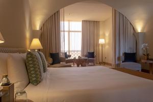 Voodi või voodid majutusasutuse Liwa Hotel toas
