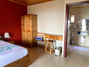 Postel nebo postele na pokoji v ubytování Exotic Guest House