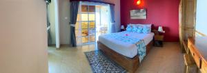 Postel nebo postele na pokoji v ubytování Exotic Guest House