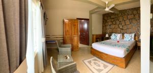 Postel nebo postele na pokoji v ubytování Exotic Guest House