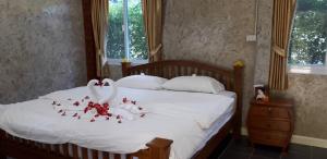 Postel nebo postele na pokoji v ubytování Paradise Resort at Lamphun