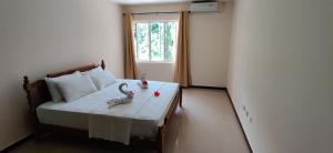 Кровать или кровати в номере Jaidss Holiday Apartments 1