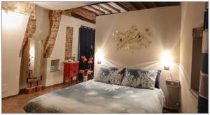 Posteľ alebo postele v izbe v ubytovaní Il Giardino sul Tetto B&B