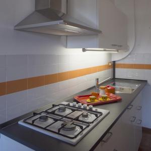 A kitchen or kitchenette at Appartamento 53