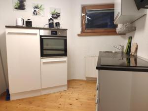 Kuchyň nebo kuchyňský kout v ubytování Apartment Martina