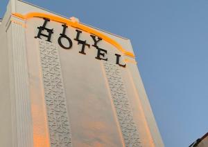 a hotel sign on the side of a building at lily airport otel in Arnavutköy