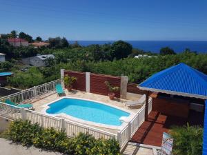 a large swimming pool with a deck at THE ISLAND PARADISE in Baillif