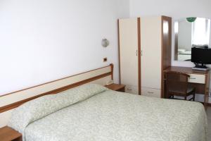 Postel nebo postele na pokoji v ubytování Hotel I 4 Assi