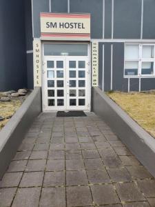 a building with a snm hostel with a door at SM Hostel in Reykjavík