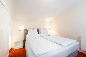 Ένα ή περισσότερα κρεβάτια σε δωμάτιο στο Hotel Garni Keil