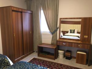 Ein Bett oder Betten in einem Zimmer der Unterkunft الشروق شقه فندقيه vip البيت بيتك
