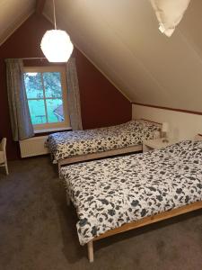 Ένα ή περισσότερα κρεβάτια σε δωμάτιο στο Thil's Bed and Breakfast